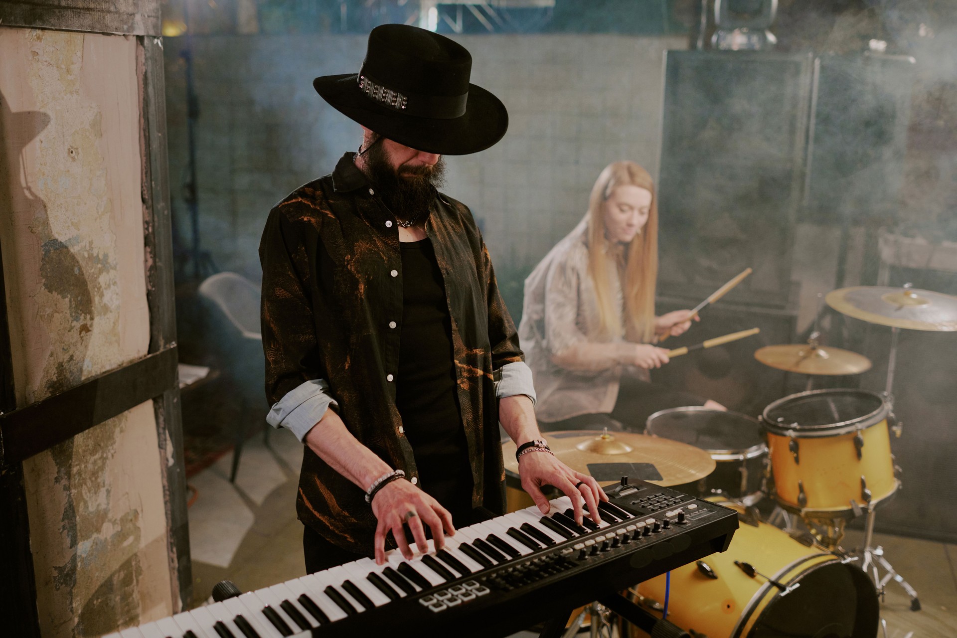Bearded Man In Hat Playing Synthesizer